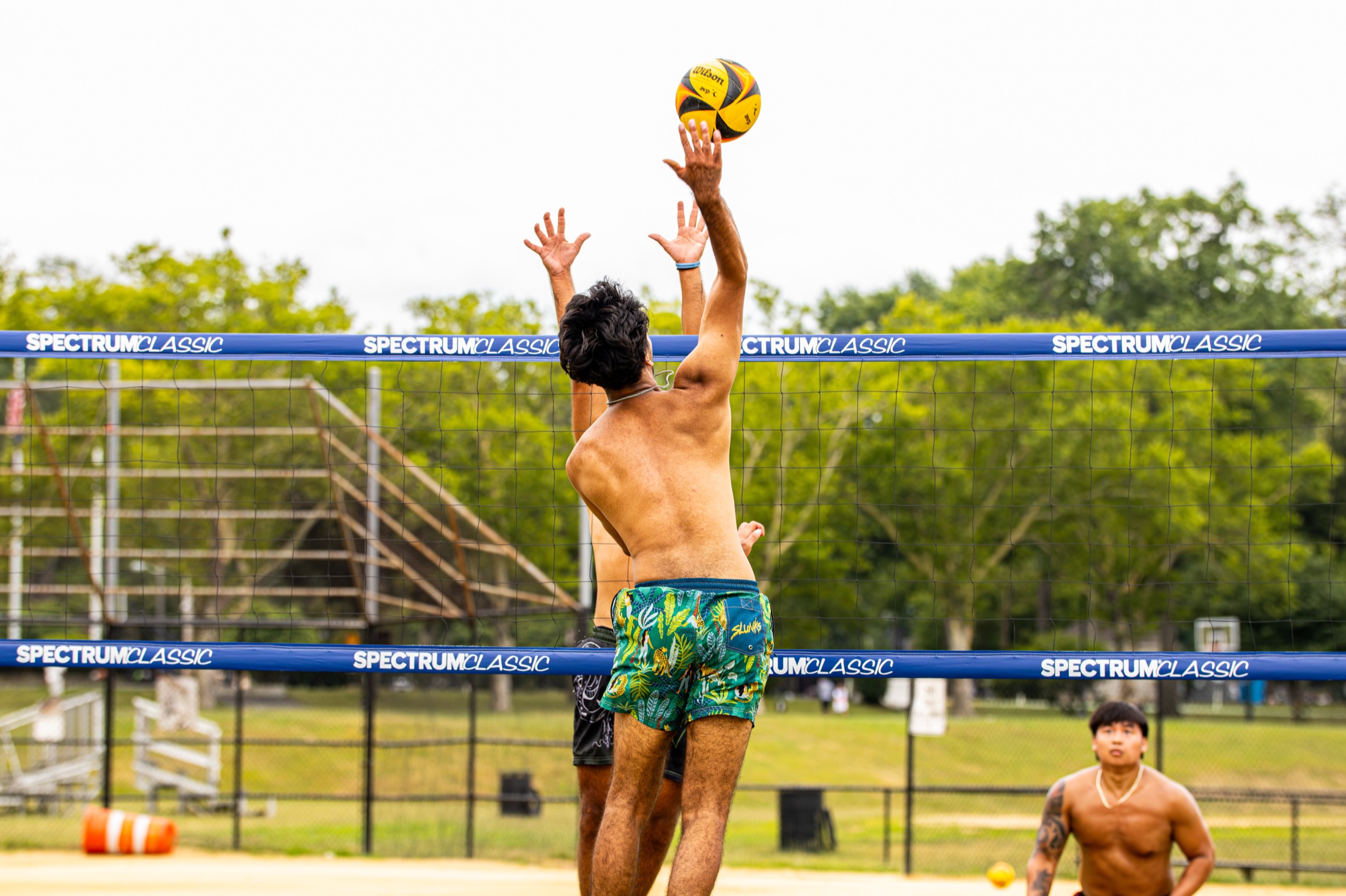 College Grass Open grass volleyball action